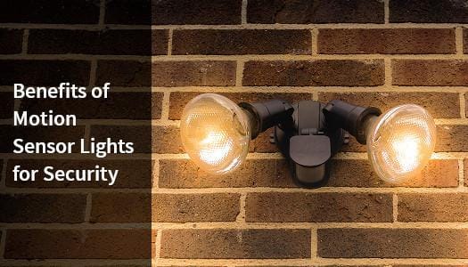 Motion sensor lights mounted on a wall for security.